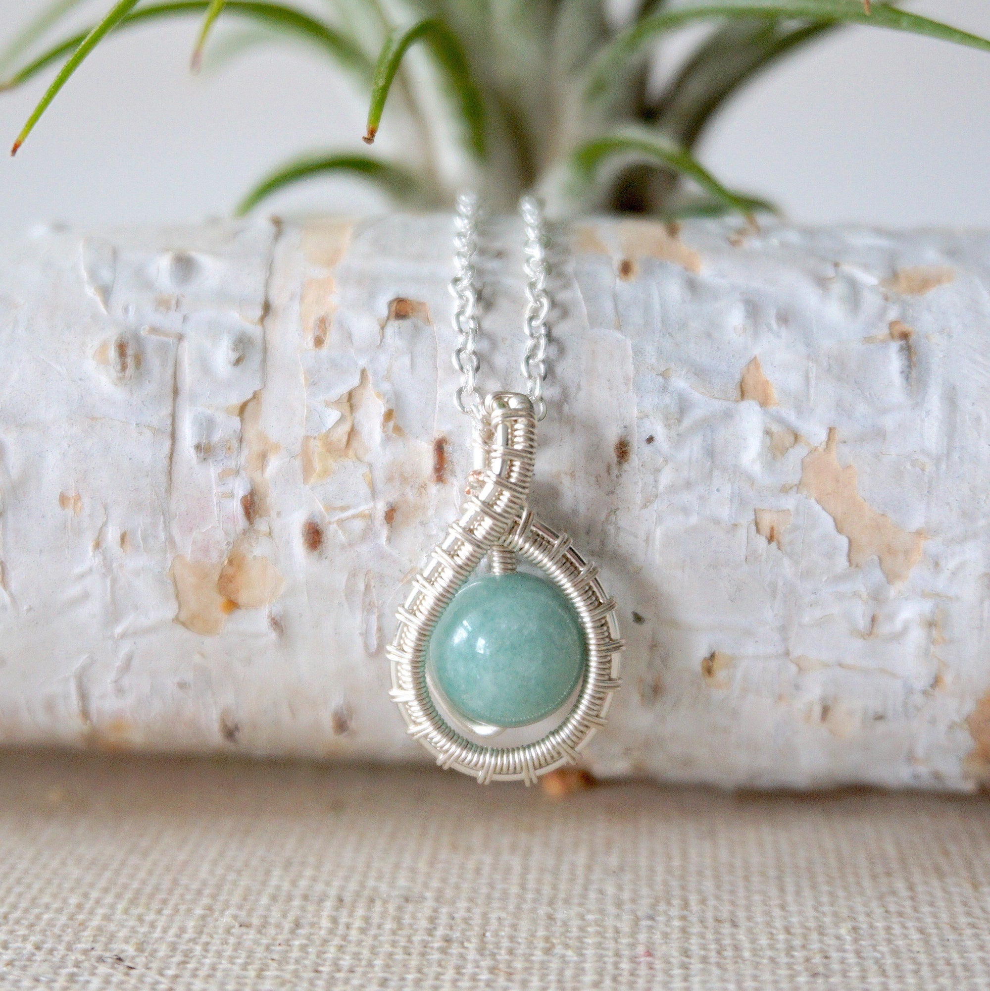 Detailed front view of aquamarine necklace for women, artisan wire wrapped in soft silver finish, Designs by Nature Gems