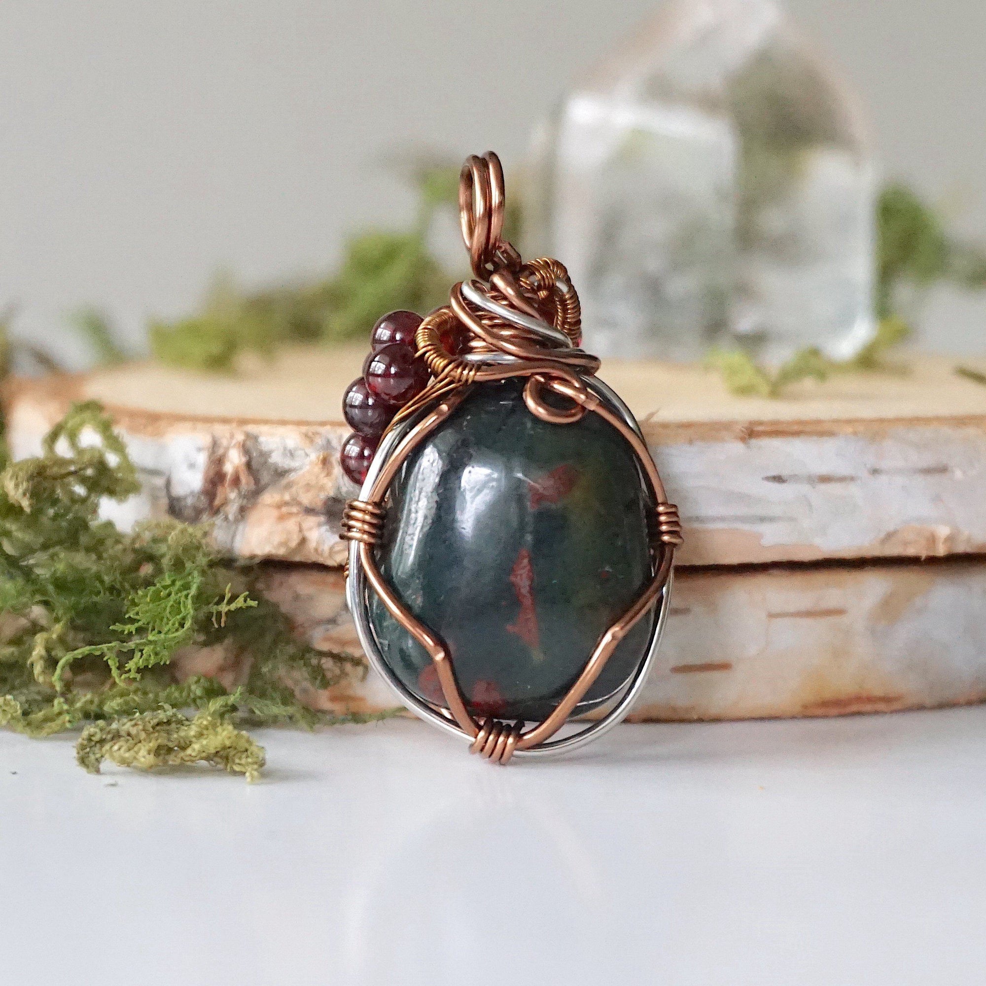 Detailed back view of a bloodstone pendant necklace showing secure handcrafted wire wrapping