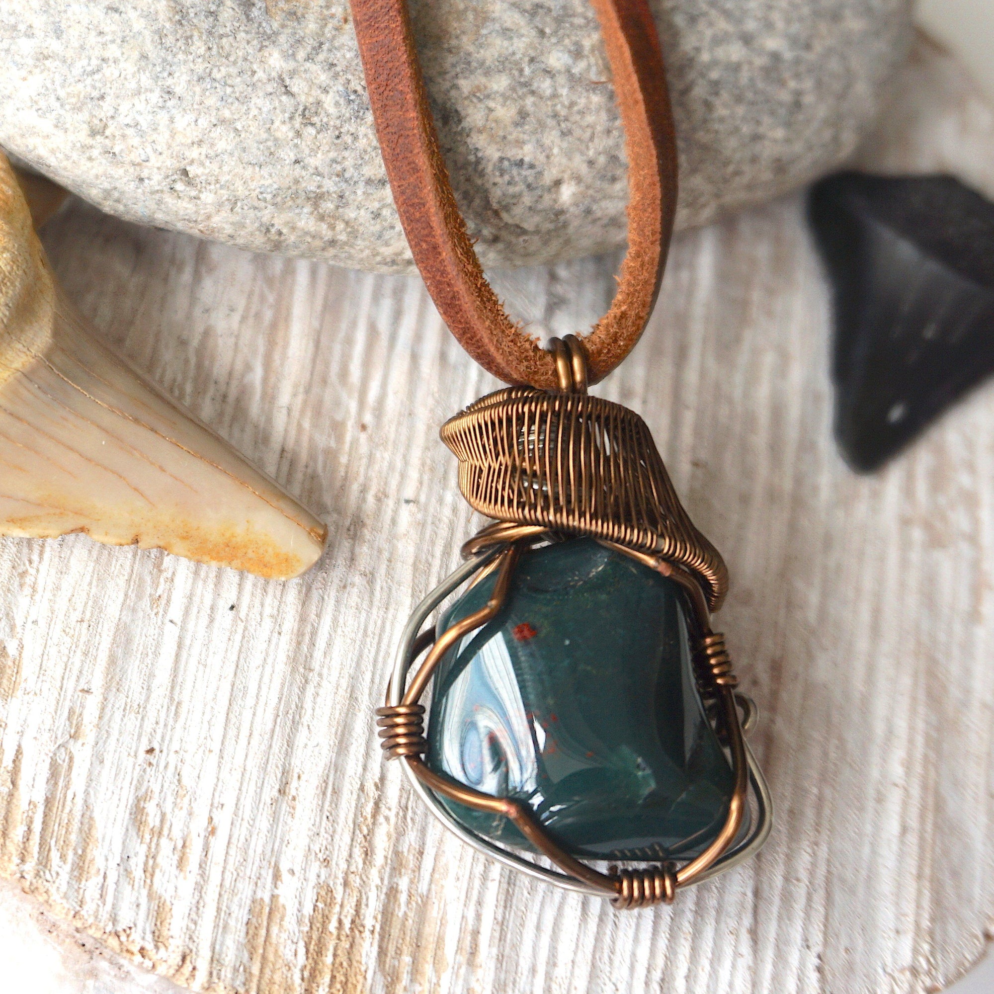 Detailed front view of natural bloodstone necklace, handcrafted crystal pendant by Designs by Nature Gems.