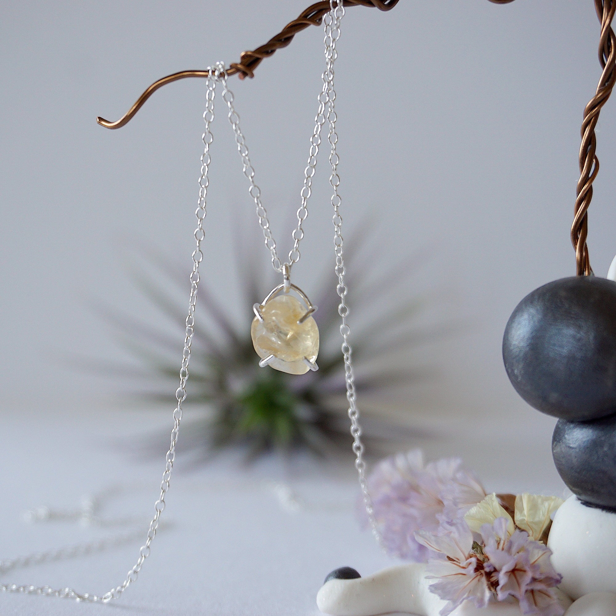 Close up front view of natural citrine crystal wire wrapped in sterling silver 925 - huggie necklace pendant detail showing golden gemstone handmade