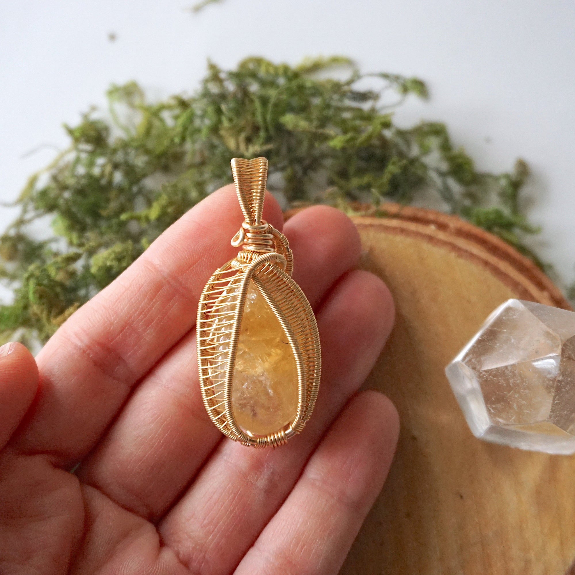 Citrine pendant gold wire wrapped held in hand showing size November birthstone necklace gift for women
