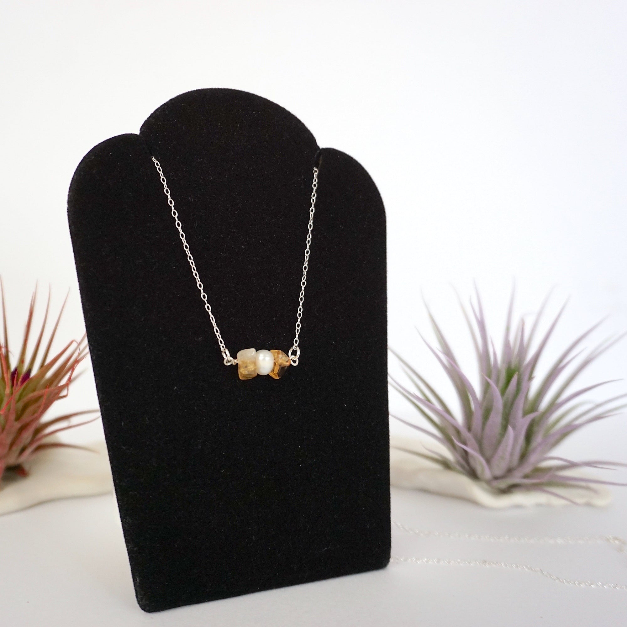 Right side angle of citrine and pearl bar necklace full length showing sterling silver 925 chain and horizontal pendant - natural crystal pearl wire wrapped jewelry