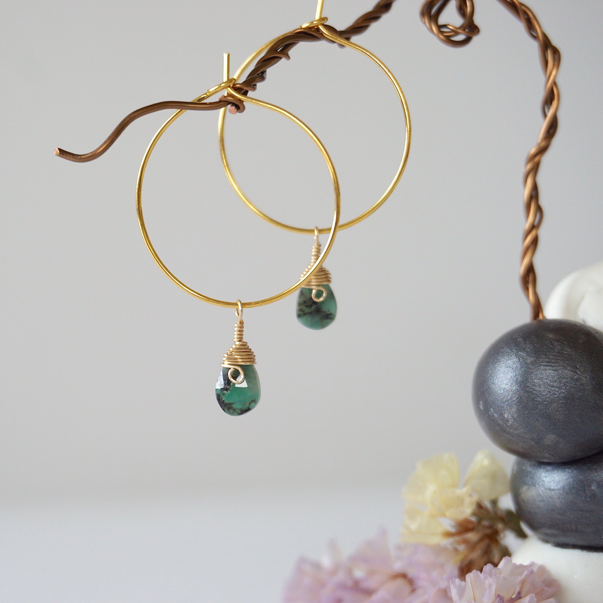 Faceted emerald hoop drop earrings in warm gold copper with natural emerald drops and minimalist artisan design