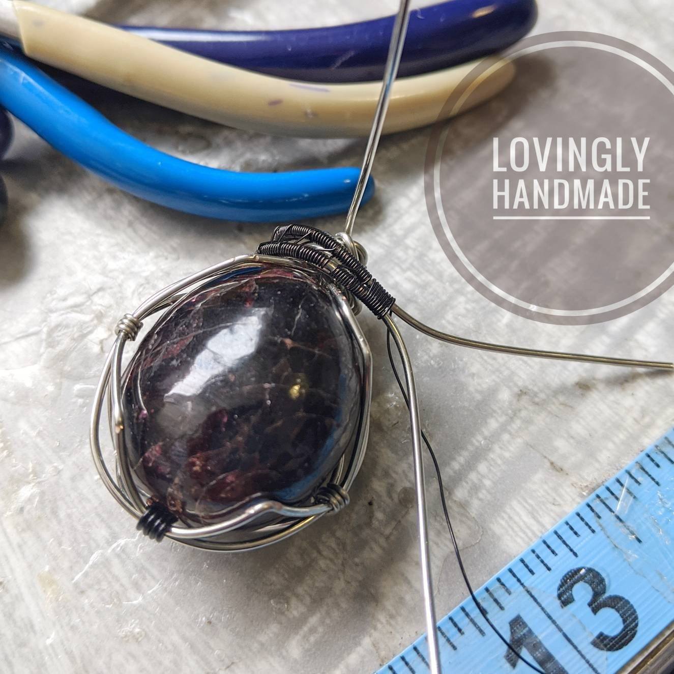 Infographic showing a garnet pendant in the making, handcrafted with care using wire wrapping techniques
