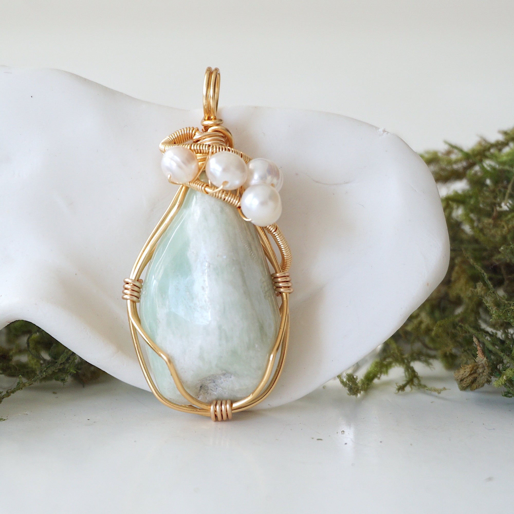 Detailed front angle of jade and freshwater pearl pendant, gold wire wrapped, handcrafted gemstone jewelry