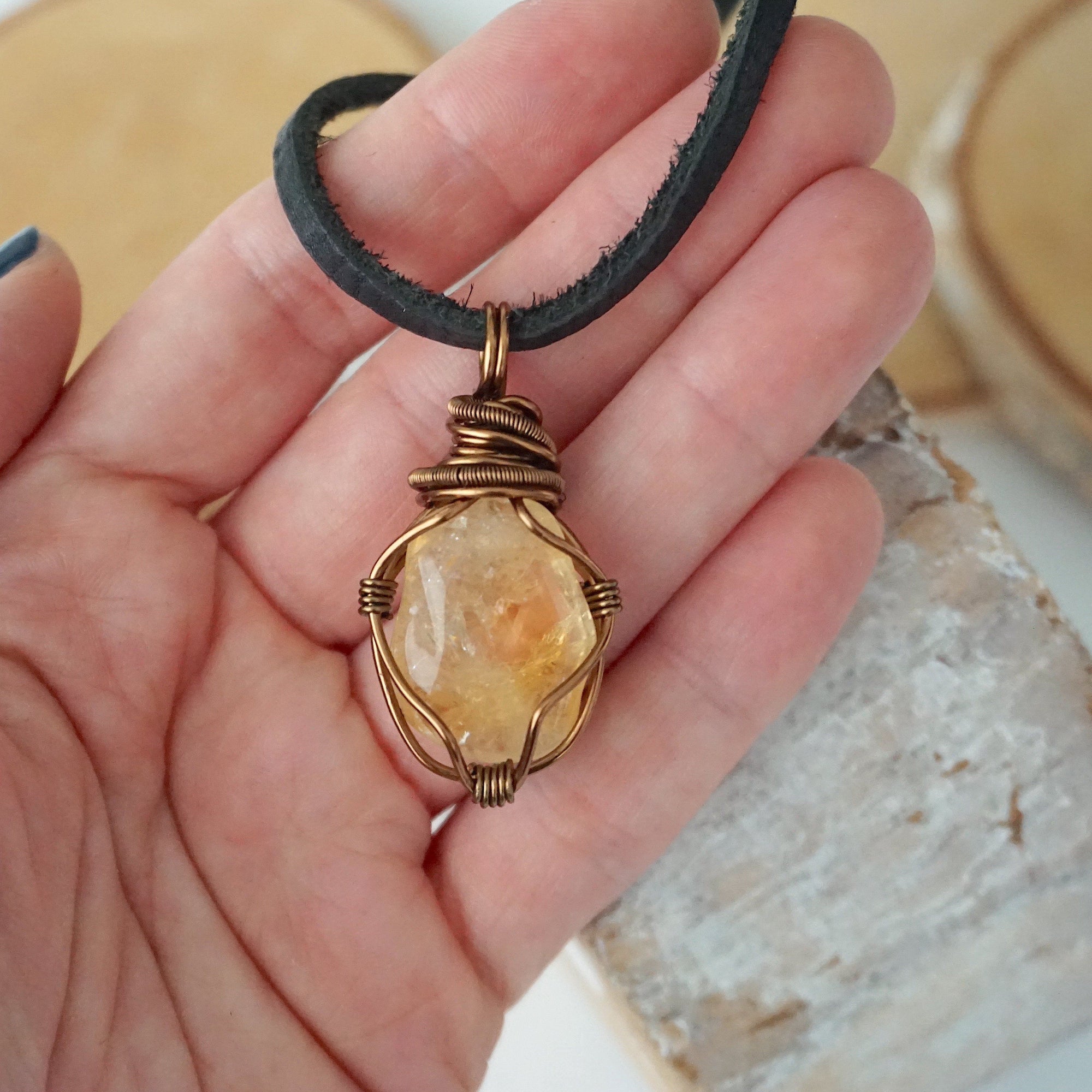 Mens citrine pendant held in hand showing size scale - natural crystal wire wrapped in antique bronze copper handmade masculine necklace size reference