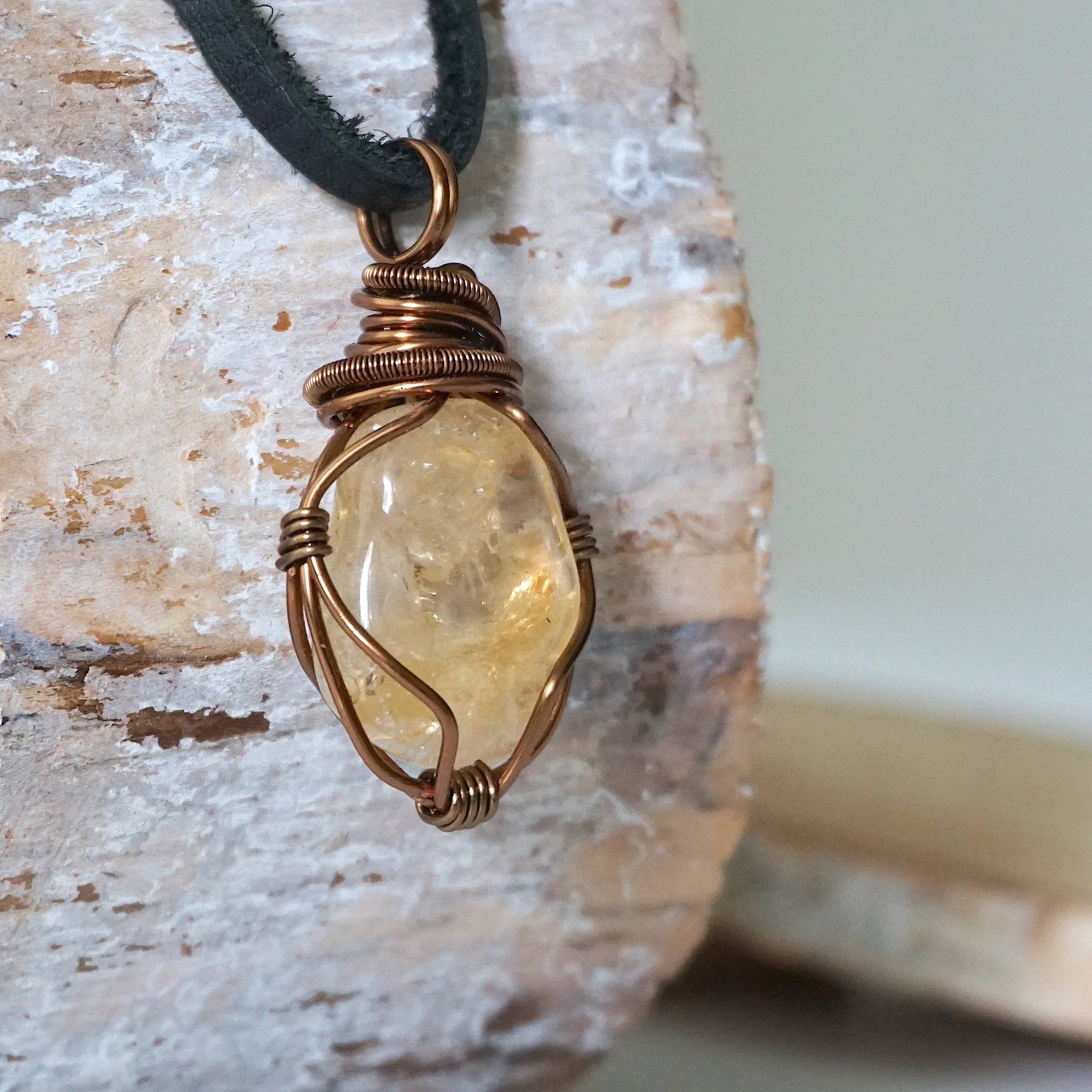 Side angle of mens citrine pendant showing crystal dimension and wire wrapping - natural stone in antique bronze copper handmade masculine necklace profile view