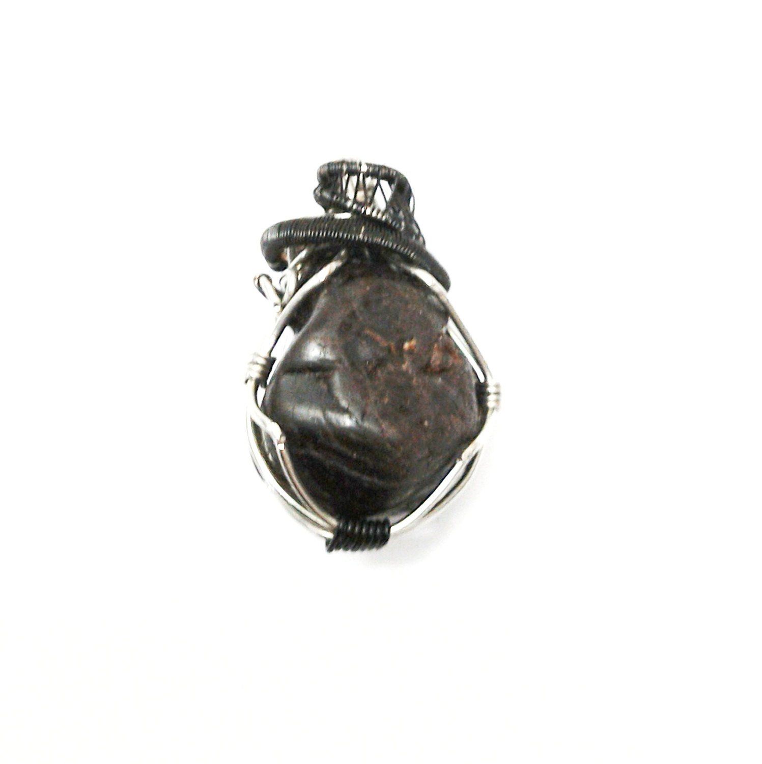 Back view of a men’s wire wrapped garnet pendant necklace showing the secure handcrafted wire work