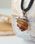 Side angle of mens raw citrine pendant showing crystal dimension and wire wrapping - natural unpolished stone in antique bronze copper handmade masculine necklace profile