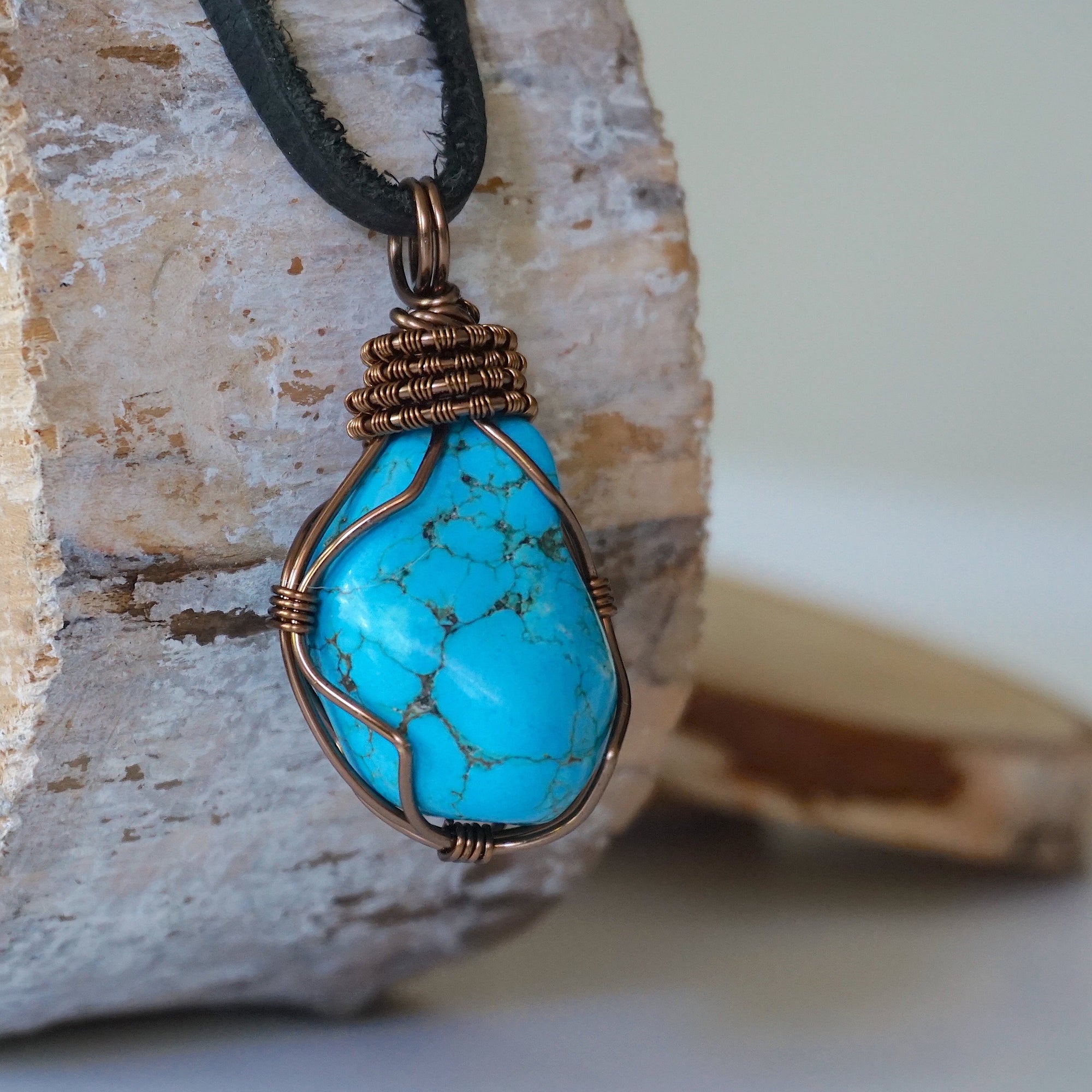 Mens raw turquoise necklace with bronze copper wire wrapping right side detail