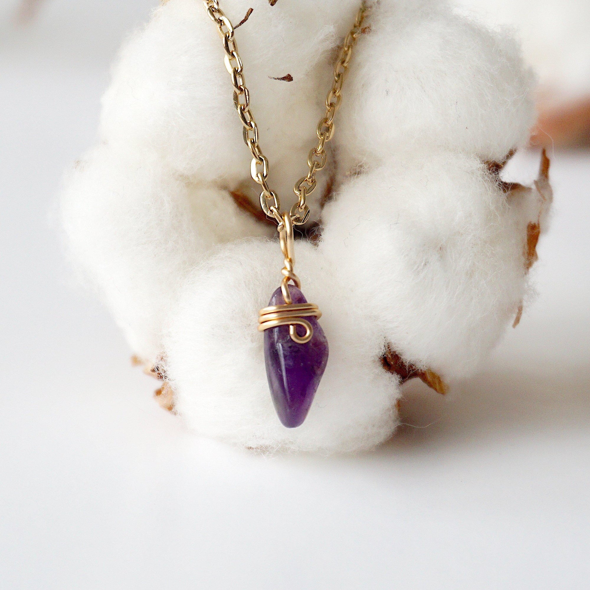 Detailed front view of minimalist amethyst necklace for women, raw amethyst pendant wire wrapped in gold plated copper