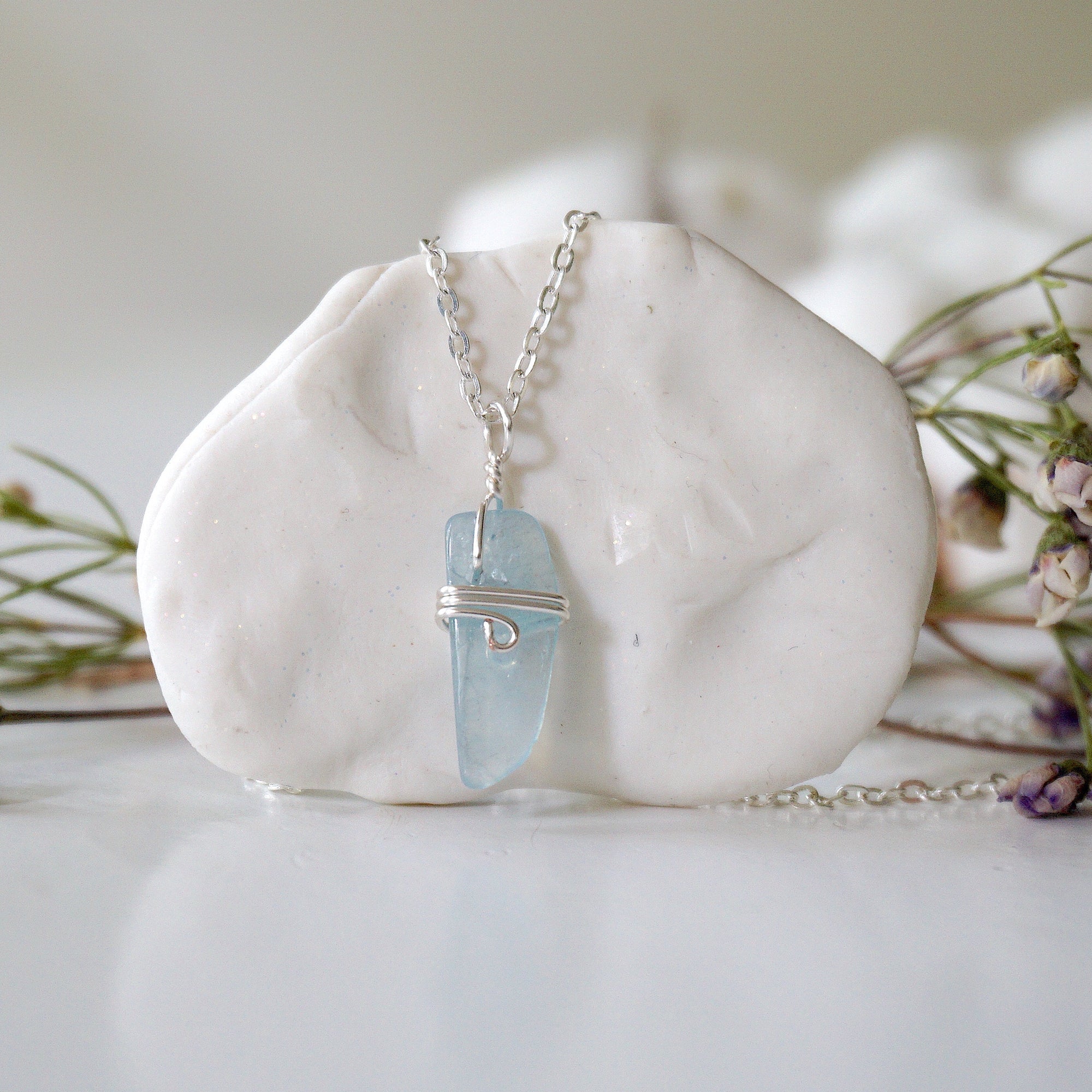 Minimalist aquamarine necklace, detailed front view, genuine polished aquamarine wrapped in soft silver finish over copper wire, March birthstone, Designs by Nature Gems