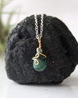 Minimalist emerald necklace for women with natural faceted teardrop emerald in 14k gold filled and sterling silver, detailed front view