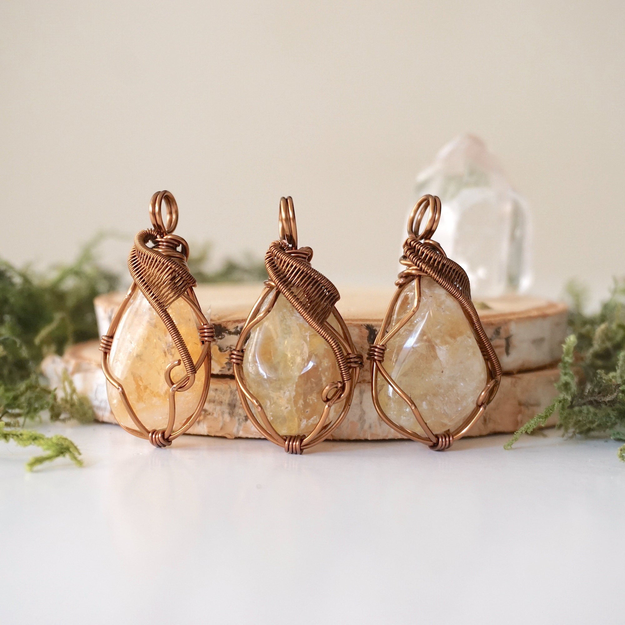 Three natural citrine crystals showing variation in color size and shape - pale yellow to golden amber unique wire wrapped antique bronze pendants one of a kind