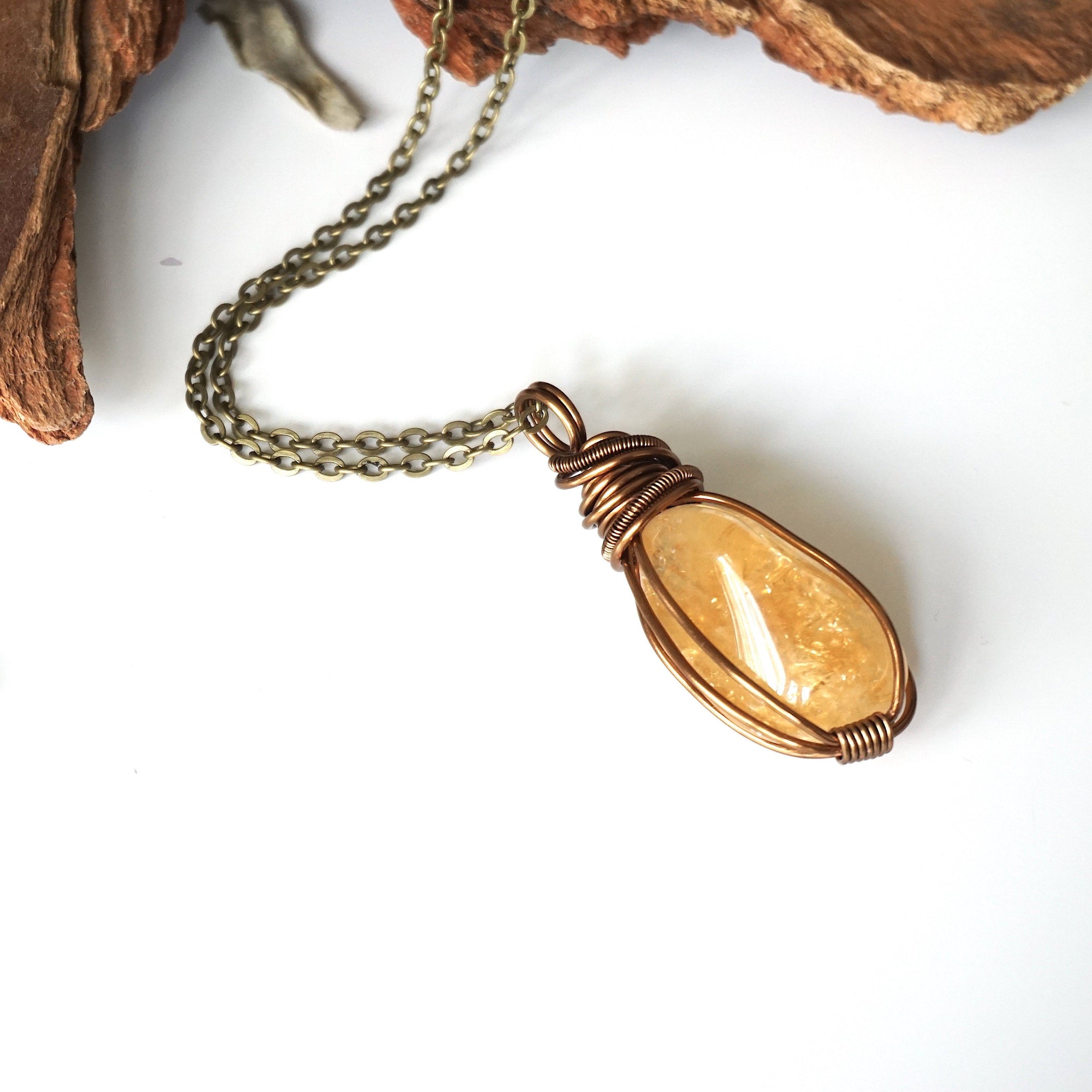 Natural citrine necklace on antique bronze copper chain laying flat - handmade wire wrapped crystal pendant unisex jewelry for women and men November birthstone
