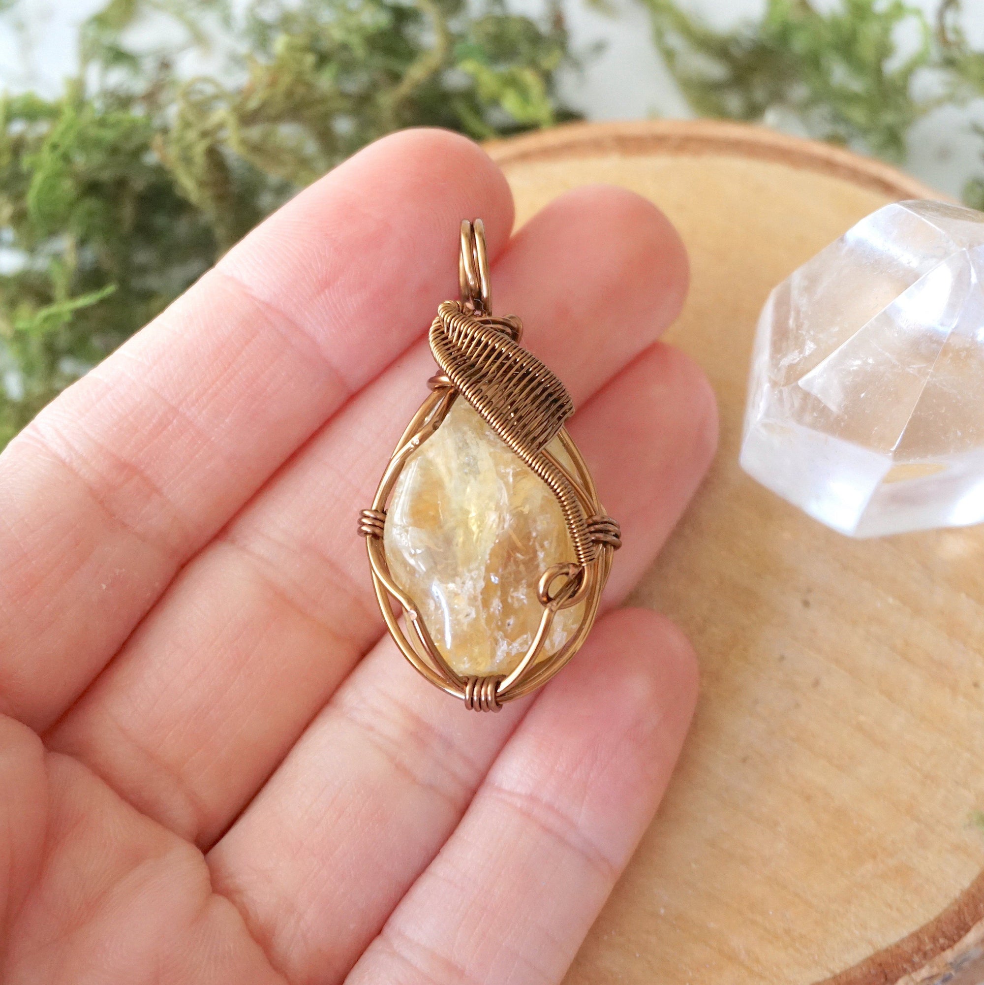 Natural citrine pendant held in hand showing size scale - wire wrapped crystal in antique bronze copper handmade necklace size reference vintage jewelry
