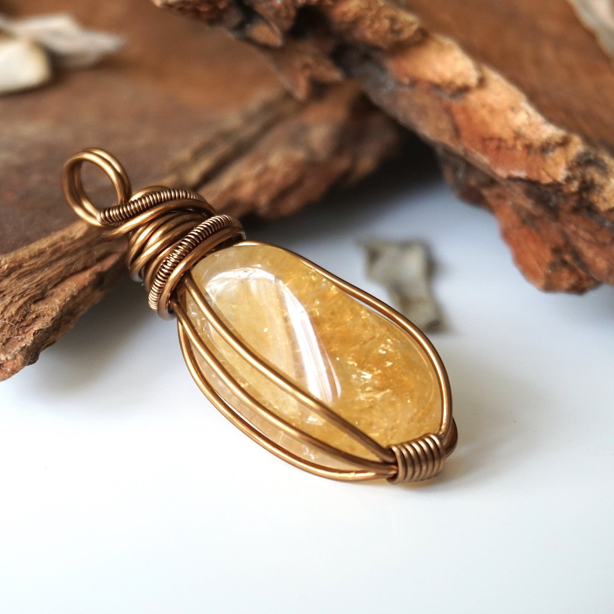 Side angle of natural citrine pendant showing crystal dimension and wire wrap detail - antique bronze copper handmade unisex necklace for women men profile view