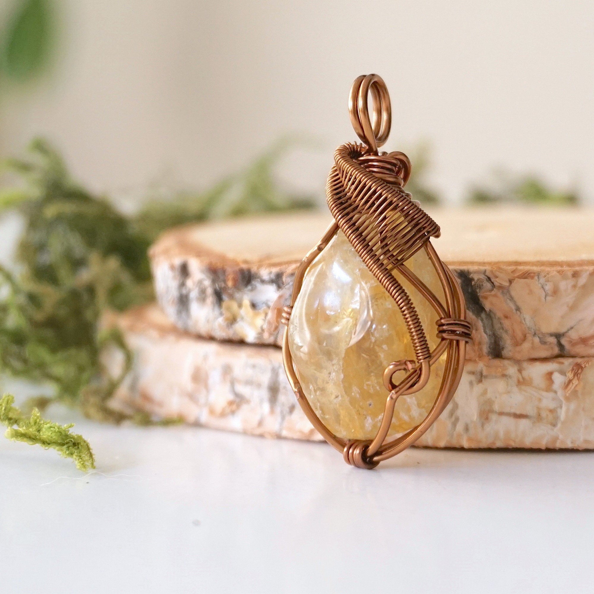 Side angle of natural citrine pendant showing crystal dimension and wire wrap detail - antique bronze copper handmade vintage necklace profile view jewelry