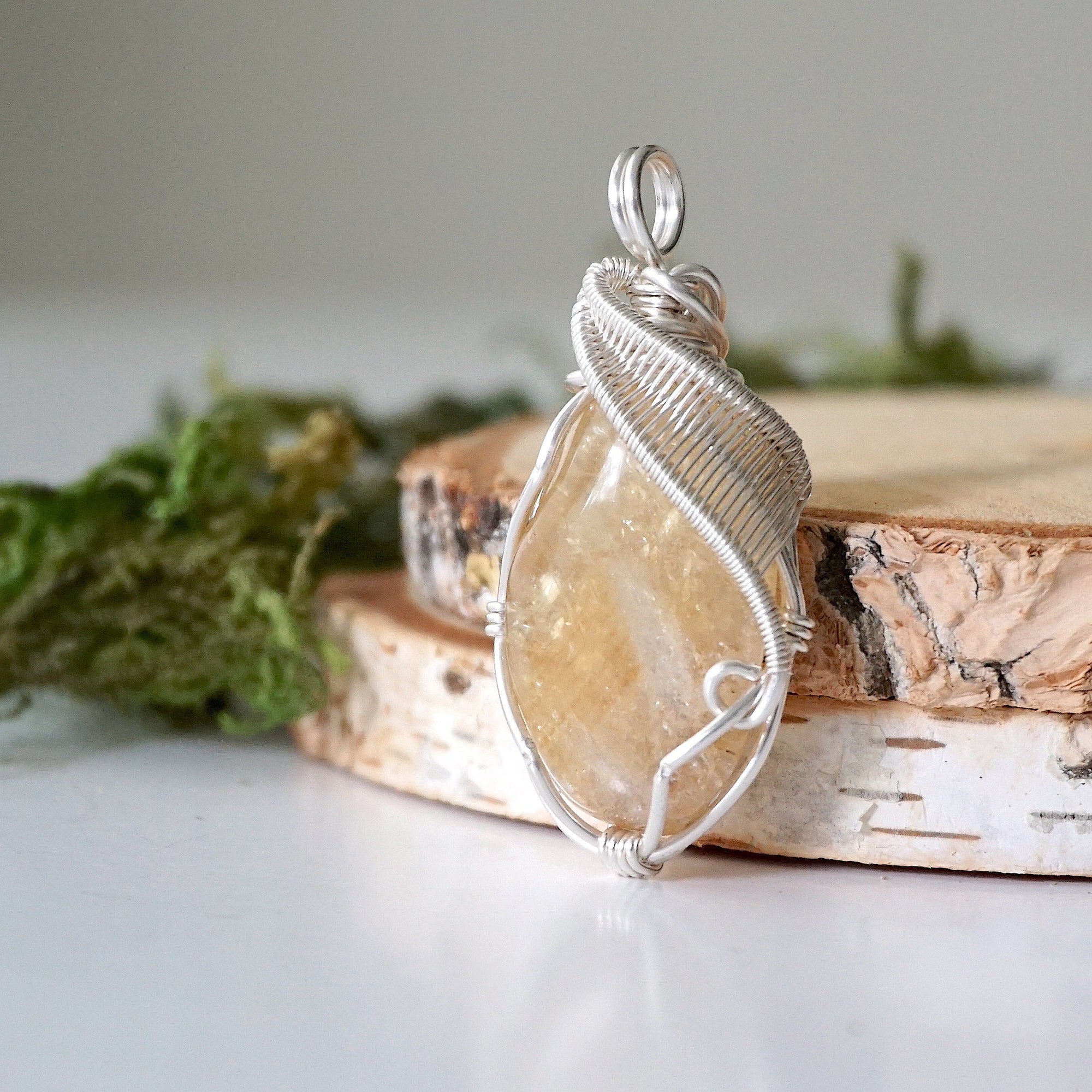 Side angle of natural citrine pendant showing crystal dimension and wire wrap detail - silver plated copper handmade minimalist necklace profile view jewelry