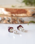 Back detail of garnet stud earrings showing 925 sterling silver posts and backs, hypoallergenic minimalist earrings