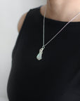 Sterling silver opal necklace on female model, artisan jewelry by Designs by Nature Gems.
