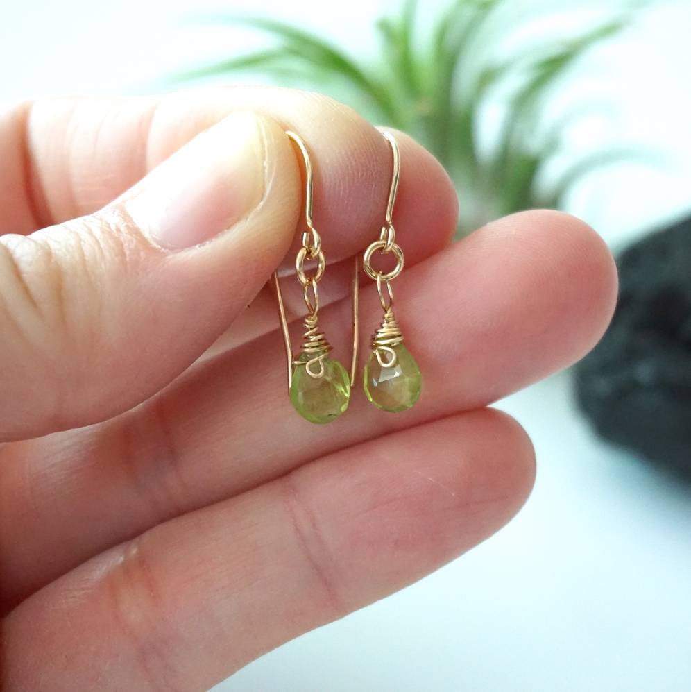 Peridot drop earrings in hand for size reference, genuine faceted peridot, 14k gold filled