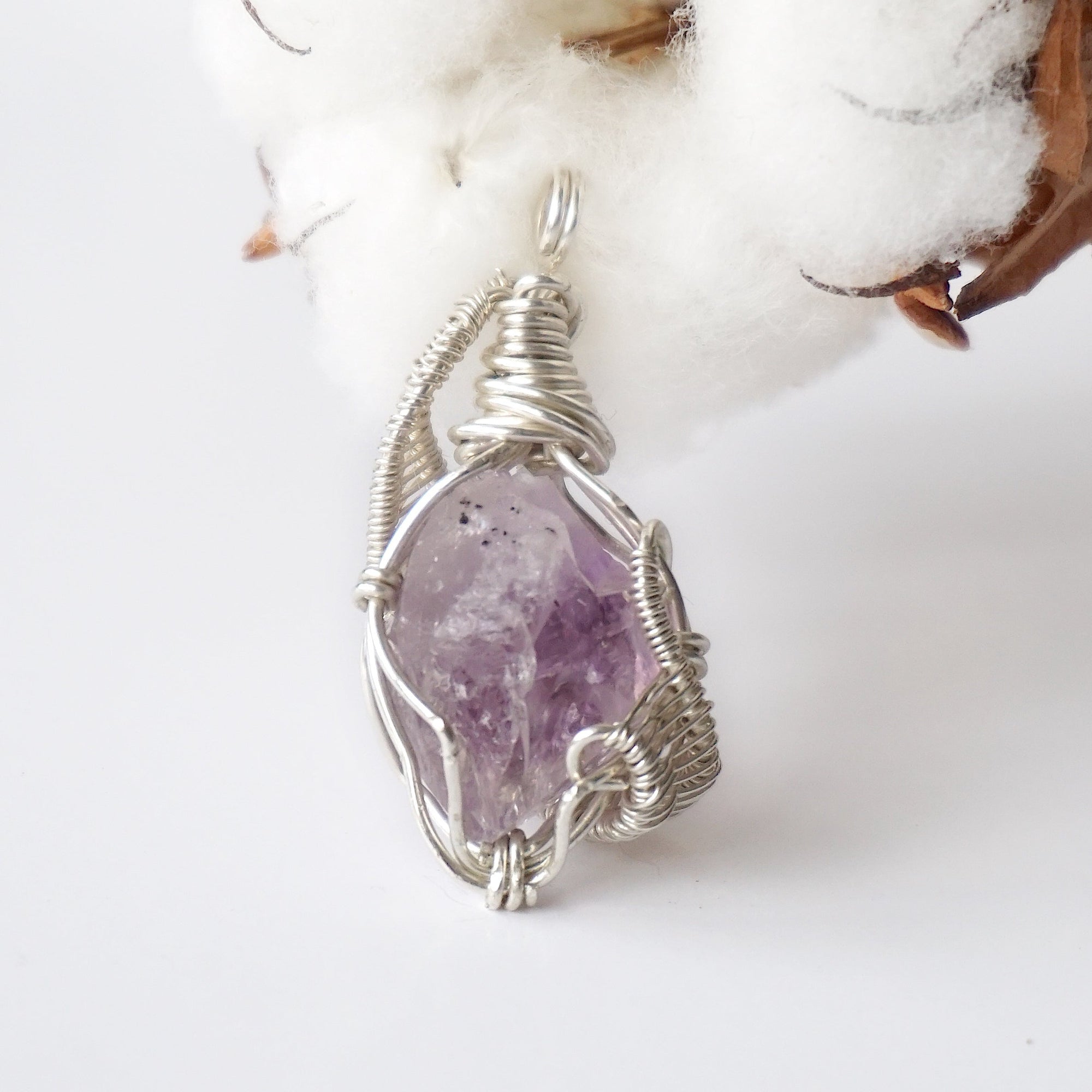 Back side angle of raw amethyst pendant, natural amethyst crystal, sterling silver artisan wire wrap