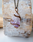Back view detail of raw amethyst point pendant necklace with detailed antique bronze copper wire wrap on antique bronze chain