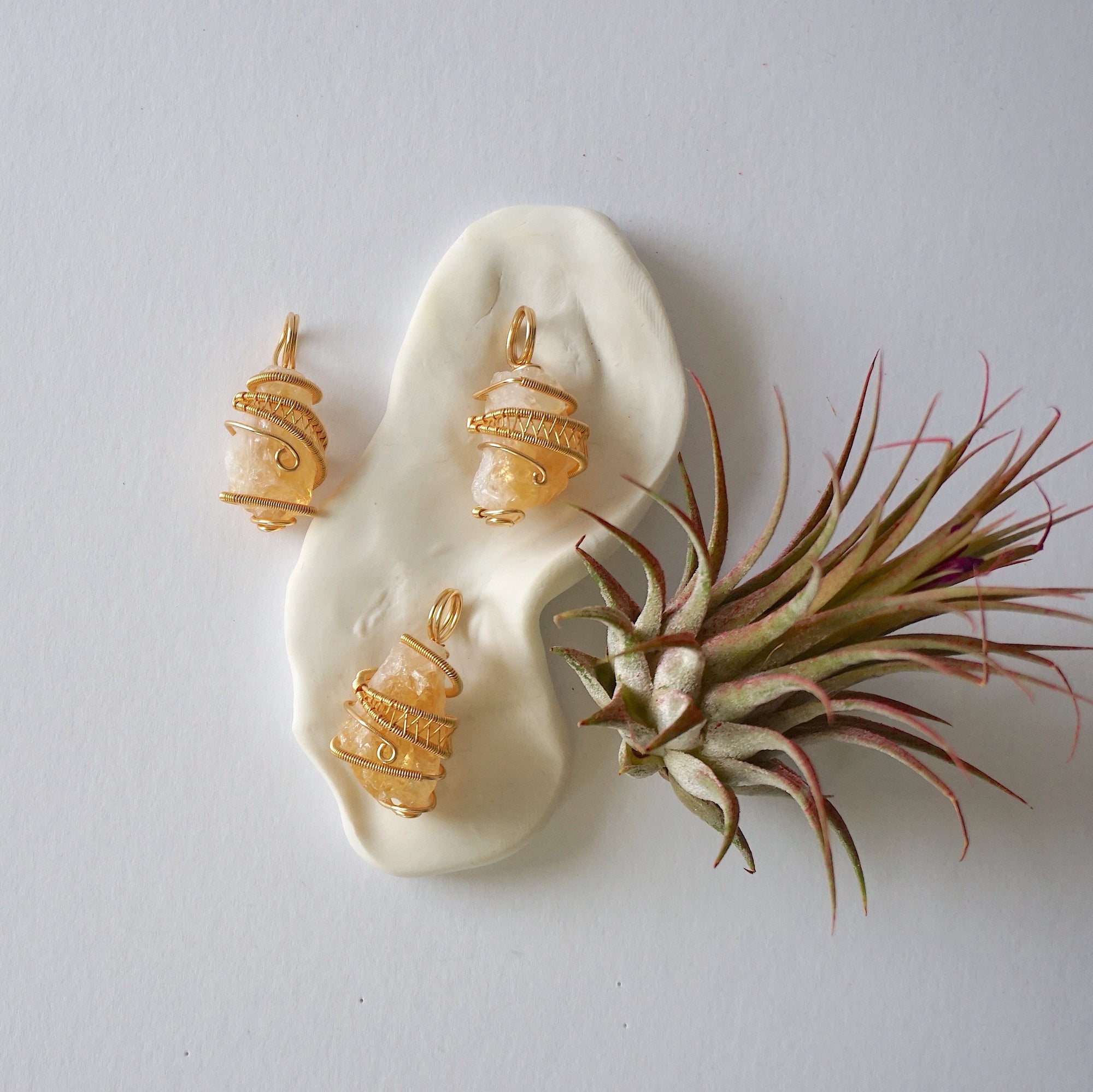 Natural citrine crystal variation showing three different raw unpolished stones - size shape color texture differences unique one of a kind citrine necklace pendants