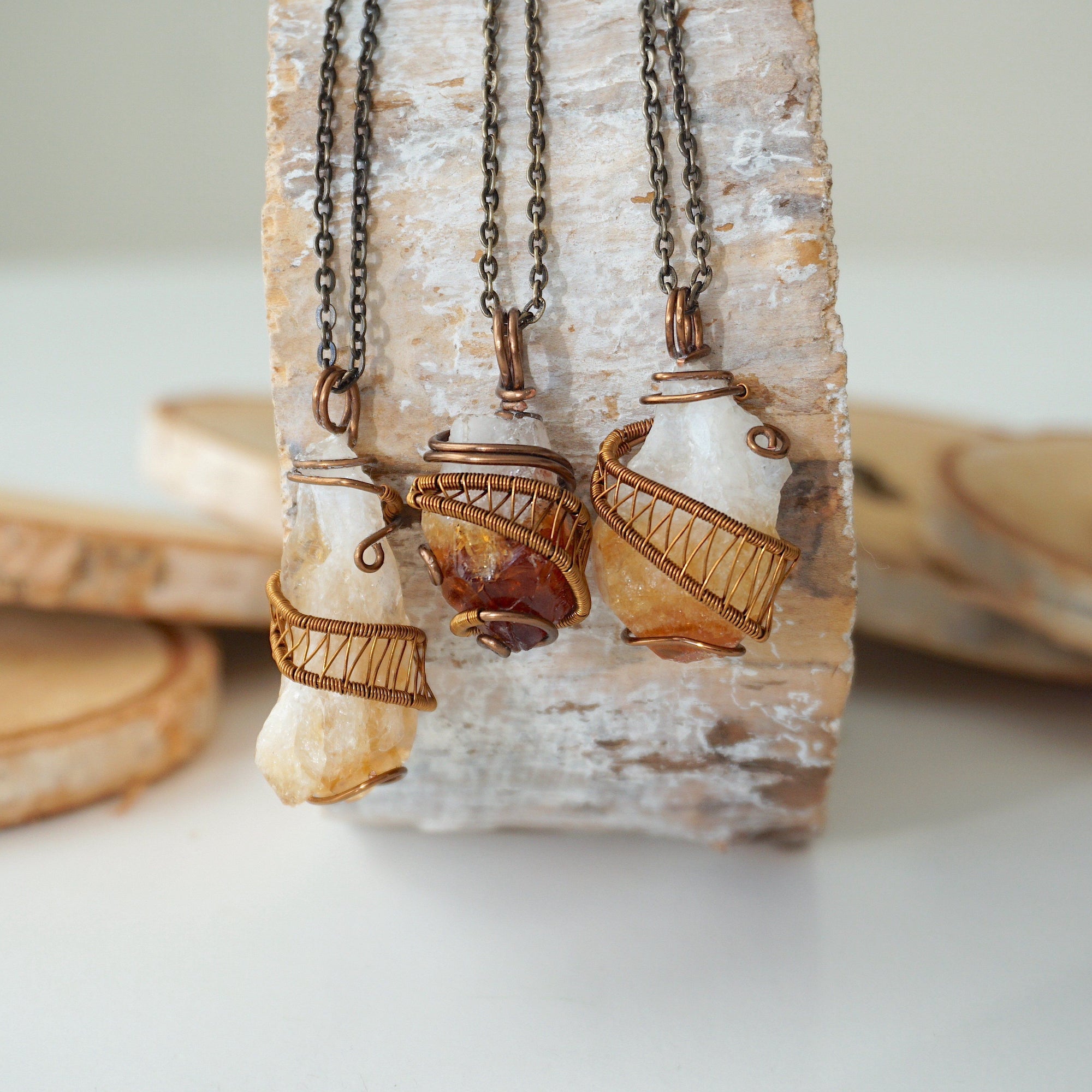 Three raw citrine necklaces antique bronze showing natural stone size shape and color variation unisex jewelry
