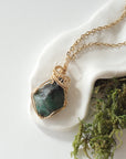 Raw emerald necklace in 14k gold-filled wire by Designs by Nature Gems, handcrafted May birthstone pendant for women.