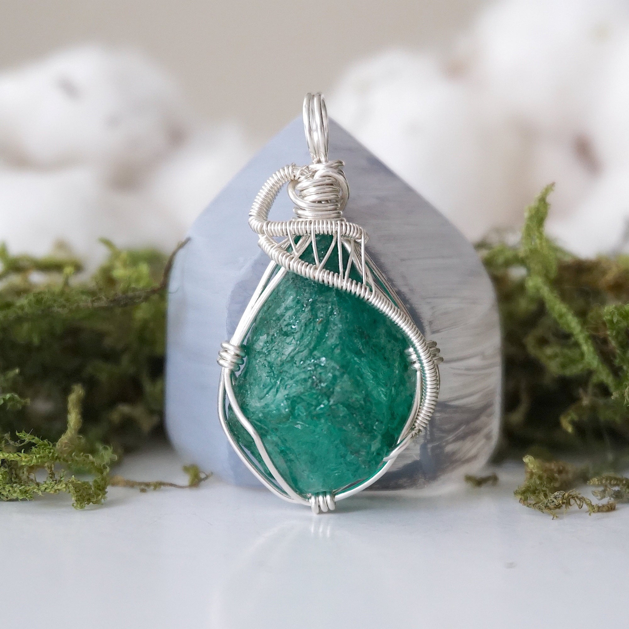 Detailed front view of raw emerald necklace for women with natural emerald and handcrafted 925 sterling silver wire wrapping