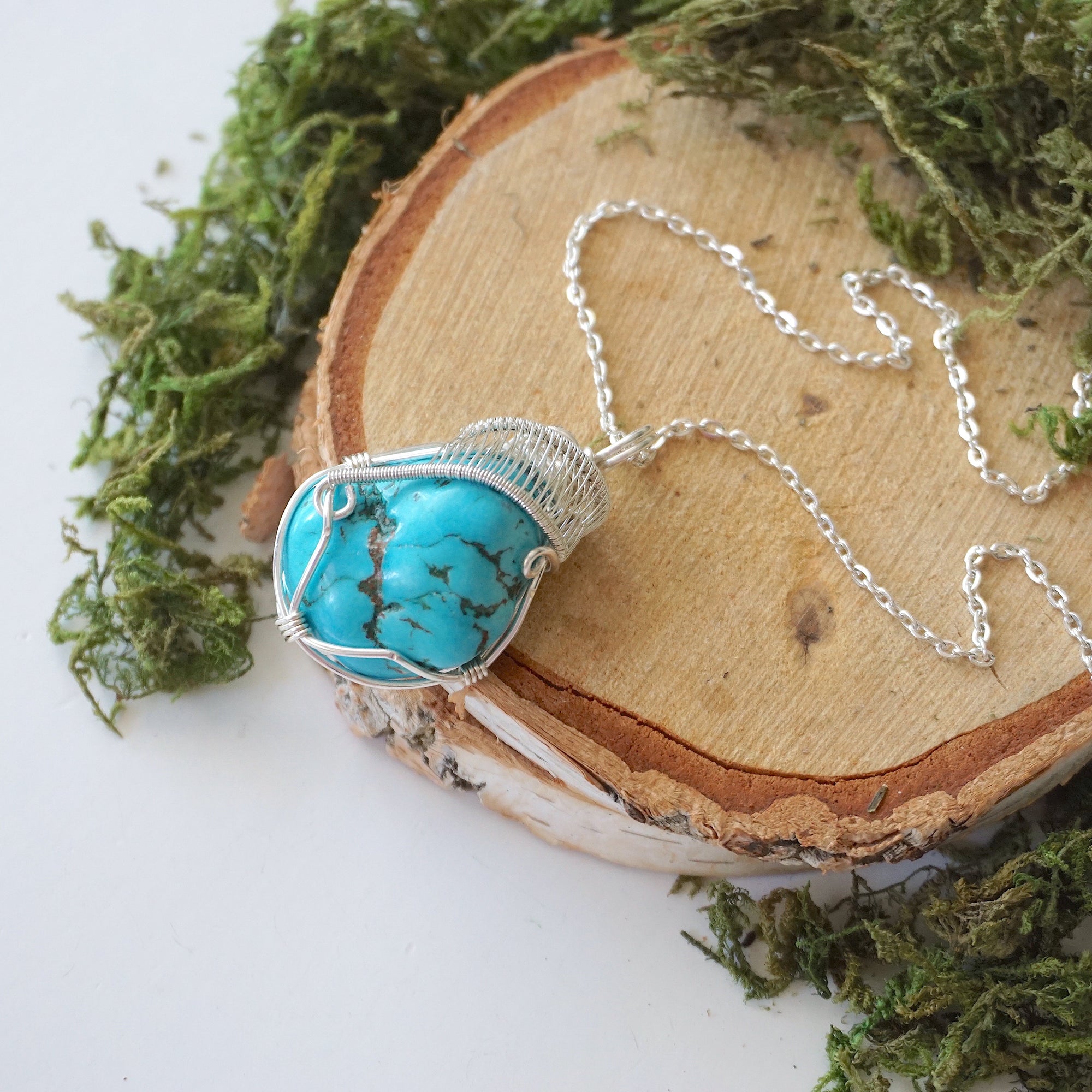 Raw turquoise necklace with silver wire wrap on silver plated brass chain