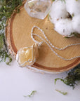 Silver and gold plated chain detail for citrine crystal necklace - mixed metal wire wrapped pendant jewelry chain closeup