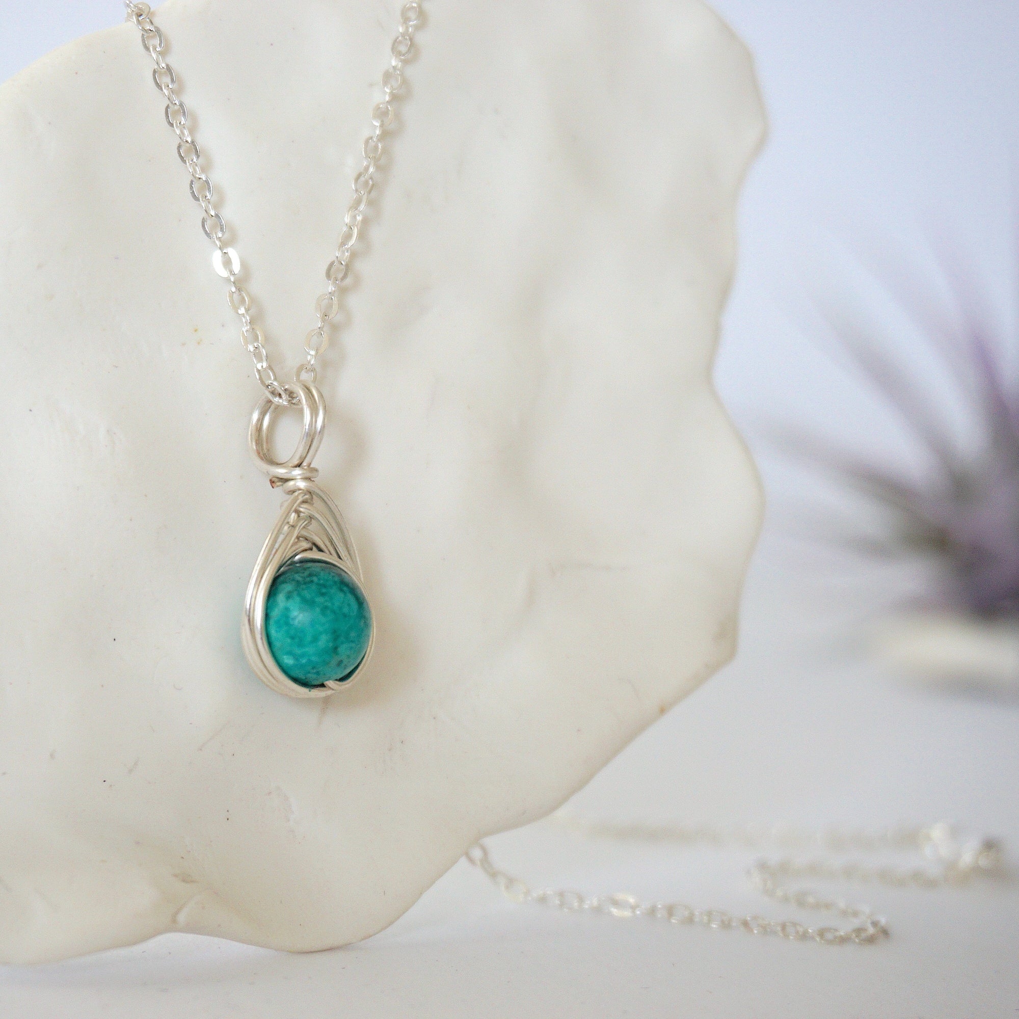 Right side angle of silver plated turquoise necklace showing stone depth detail