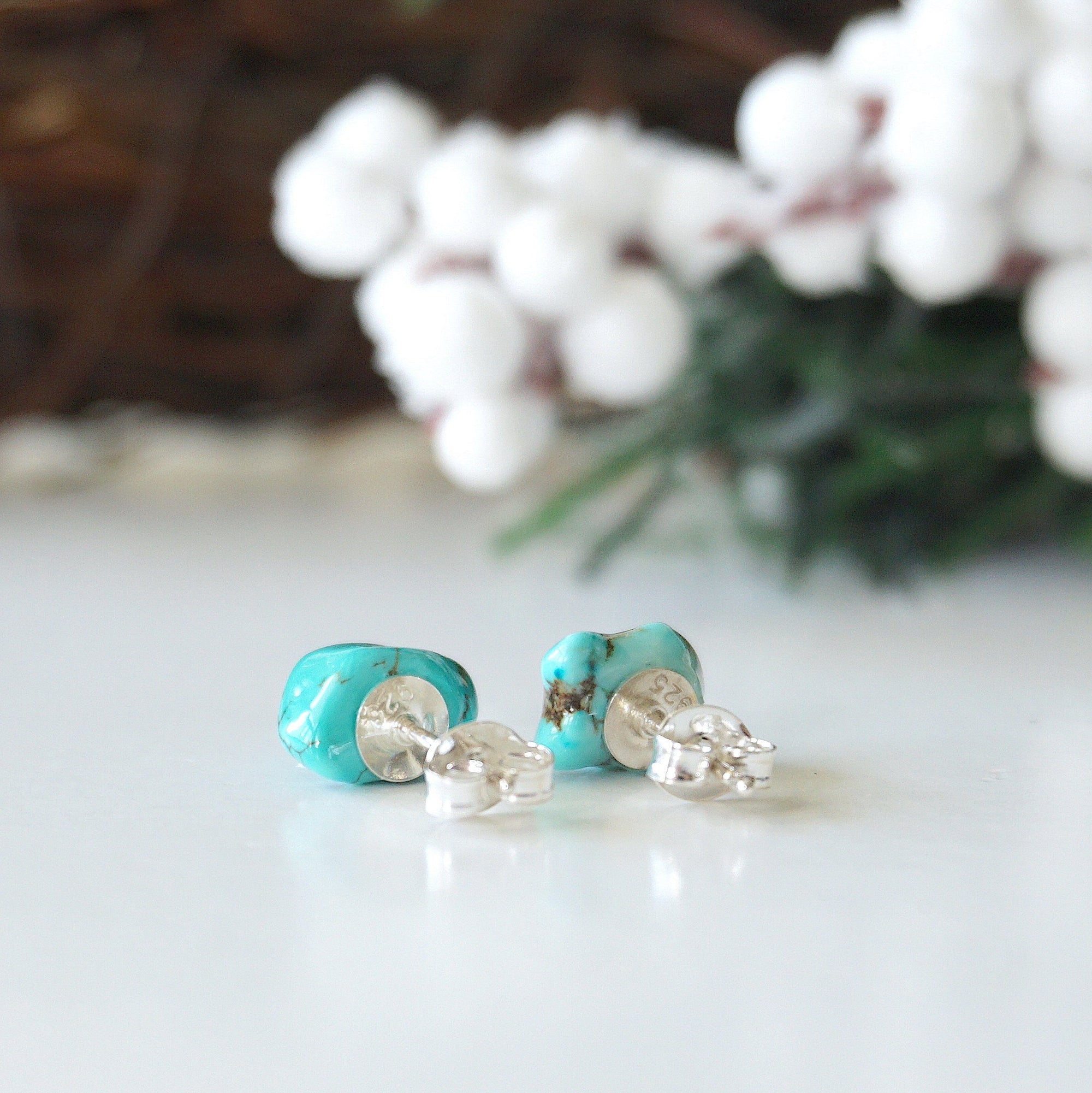 Back view of turquoise stud earrings showing sterling silver backs and secure closure system - hypoallergenic posts