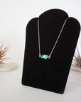 Turquoise pearl bar necklace left angle view sterling silver chain pendant