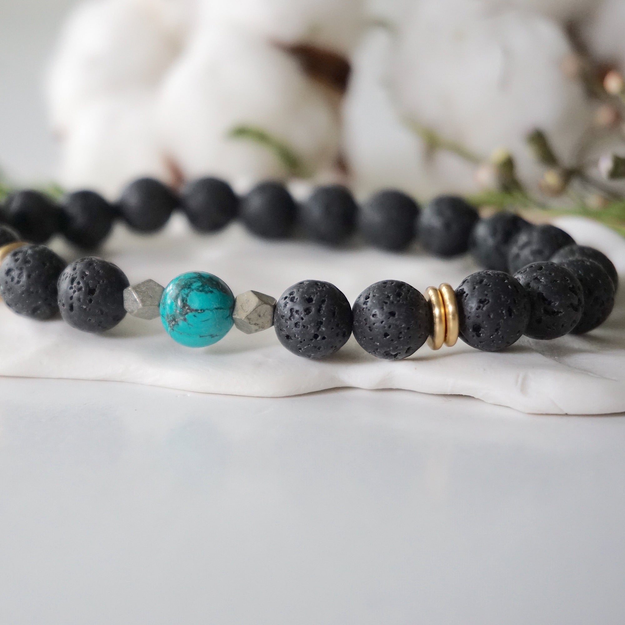 Turquoise lava bead mala bracelet close up showing natural stone and pyrite
