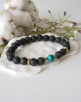 Turquoise lava bead mala bracelet with pyrite side view showing gold disks