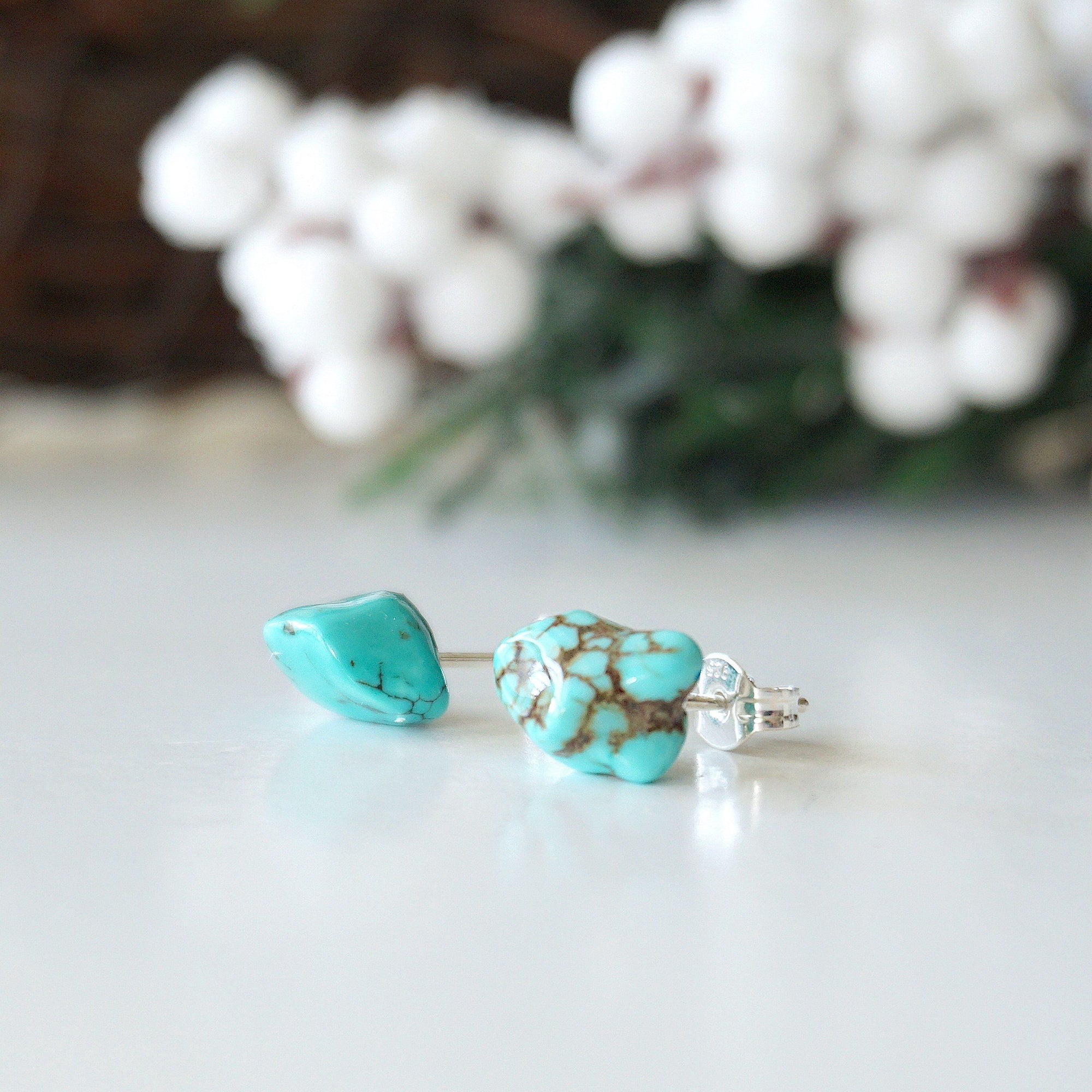 Side view of turquoise stud earrings showing sterling silver post and secure backing - hypoallergenic earrings for sensitive ears