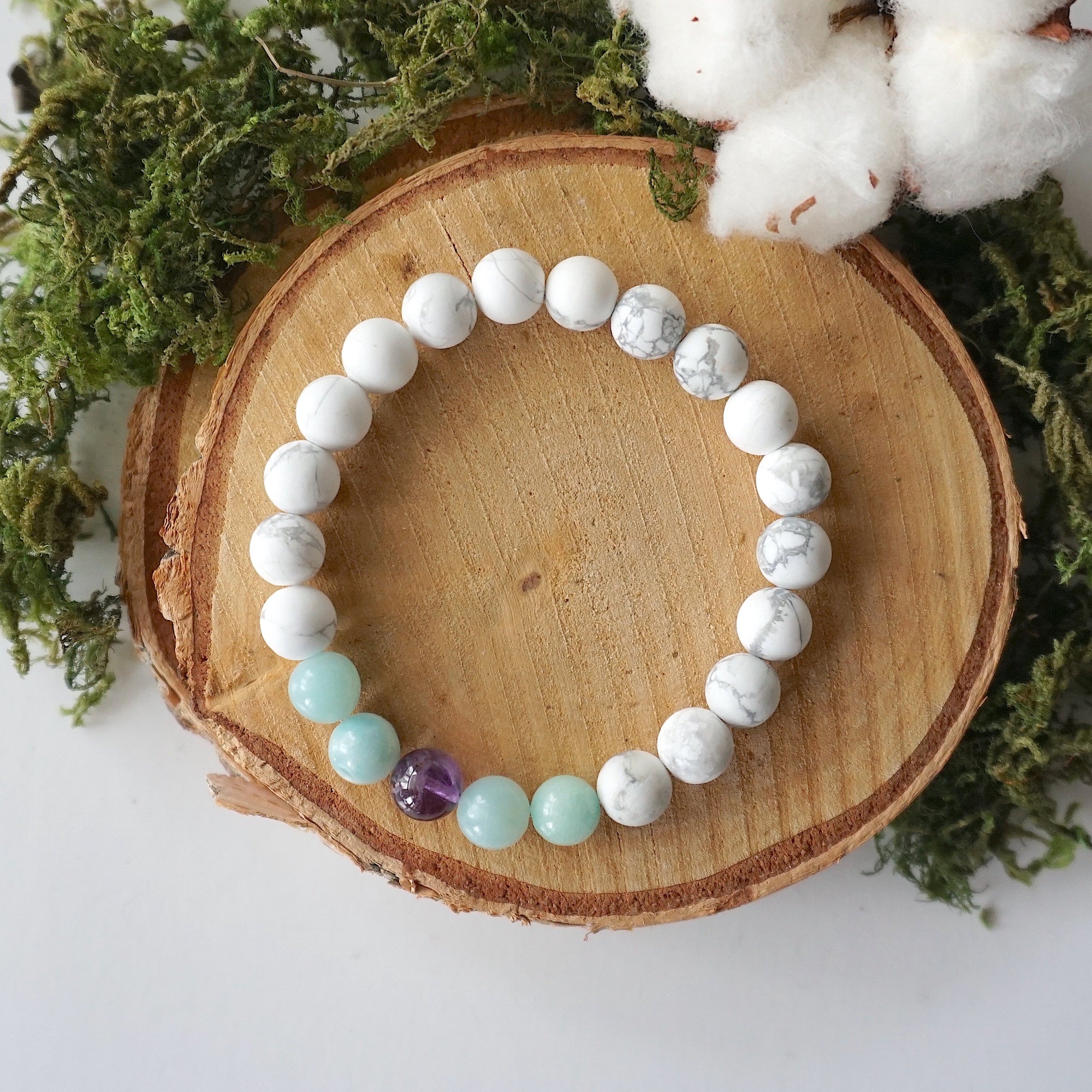 Bird’s eye top view of white howlite, amethyst, and amazonite stretch bracelet, calming crystal beaded bracelet for women