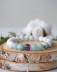 Detailed view of white howlite, amethyst, and amazonite stretch bracelet with 8mm crystal beads, calming gemstone jewelry