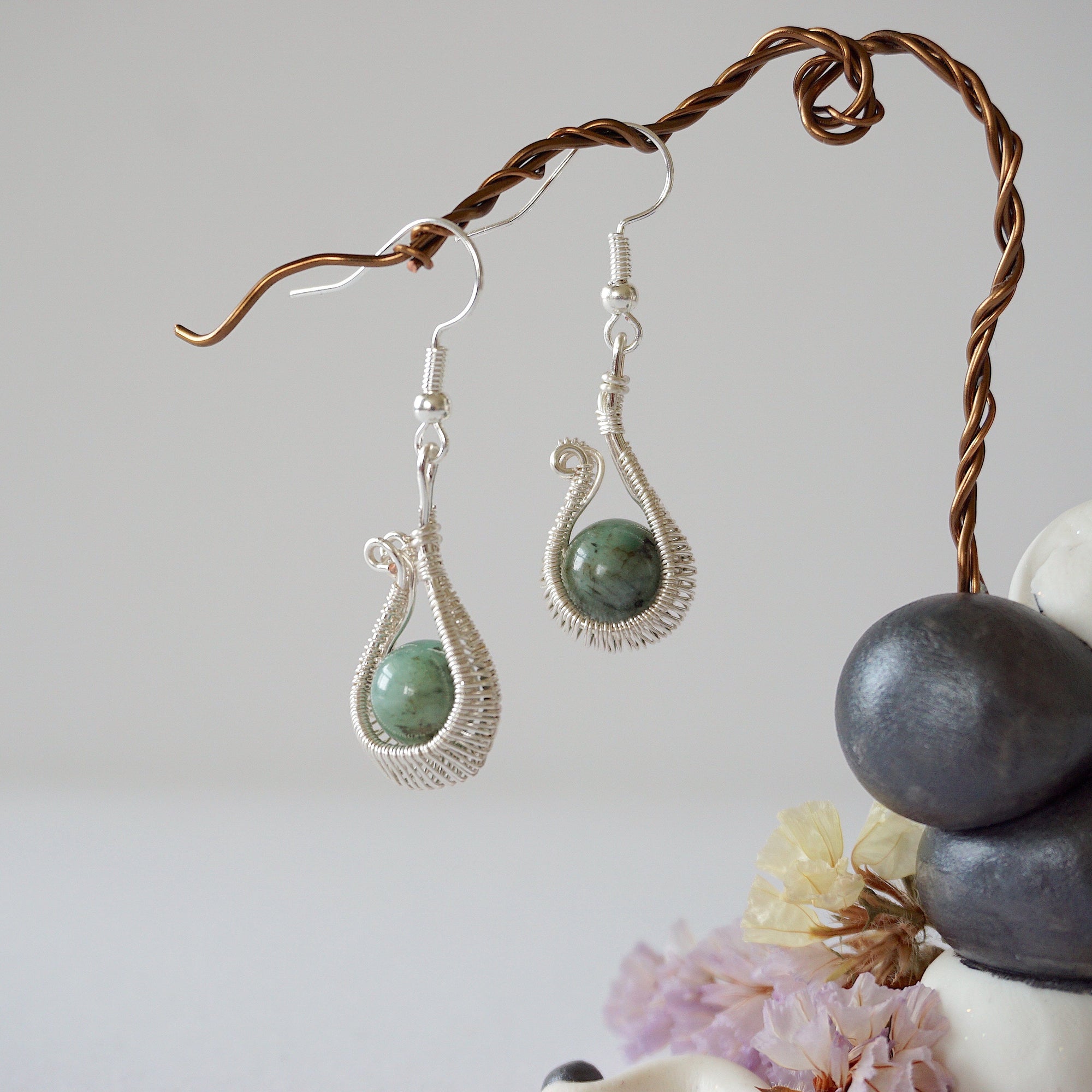 Wire wrapped emerald drop earrings in soft silver copper with natural emerald beads and handcrafted artisan design
