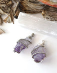 Two women’s raw amethyst pendant necklaces showing natural variation in amethyst color, shape, and size